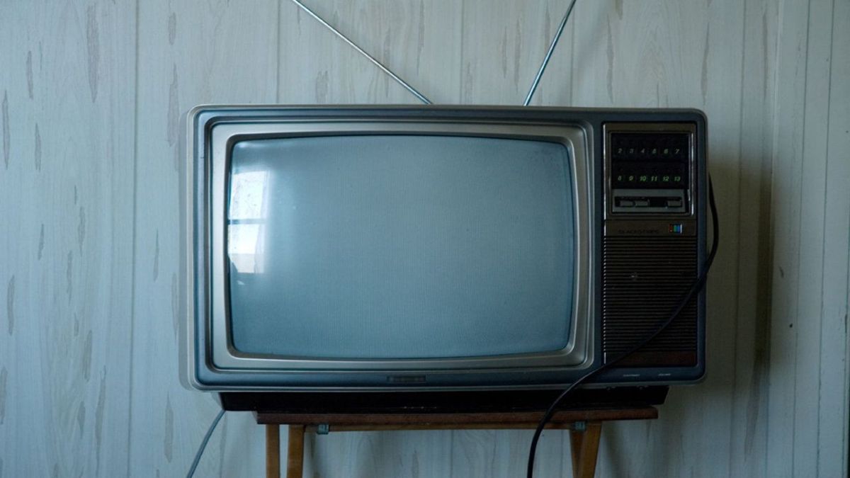 An antiquated television that ran many advertisements.