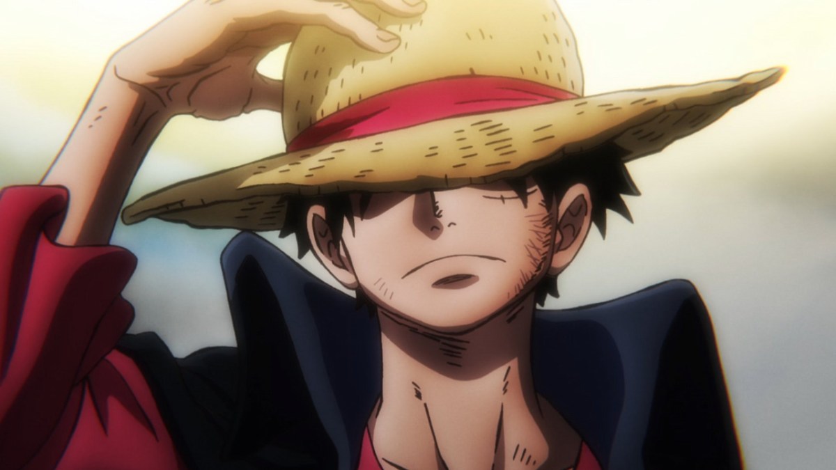 Luffy using his hat to cover his face in One Piece's anime adaptation.