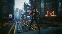 Image of a player character in Cyberpunk 2077 standing near Arasaka Tower in Cyberpunk 2077 with cars and skyscrapers nearby.