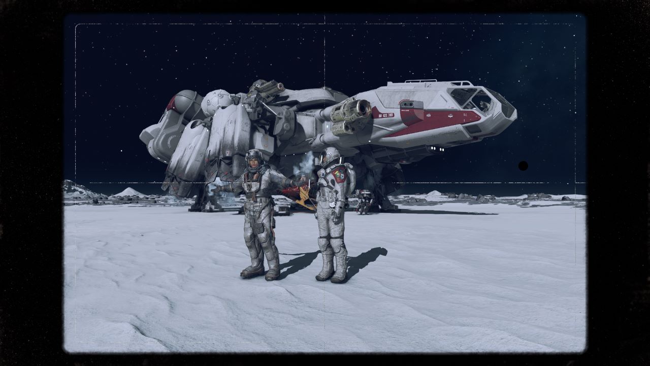 Image on a moon in the galaxy of Starfield. The player character is visible with their arms open wide and companion Sarah Morgan is next to them. The ship is in the background and a frame has been added on the image.