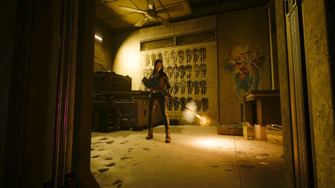 Image of the player character in Cyberpunk 2077 holding a sniper rifle with the bullet being fired. A gun wall is in the background and light shines heavily on the ground.