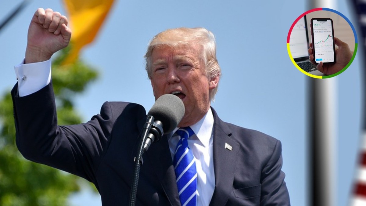 Donald Trump speaking into a microphone with his fist raised, with an inset image of a smartphone displaying a stock market chart.